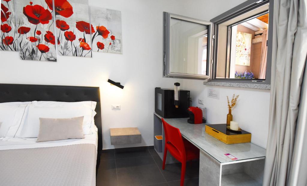 Postel nebo postele na pokoji v ubytování Elis b&b Villasimius
