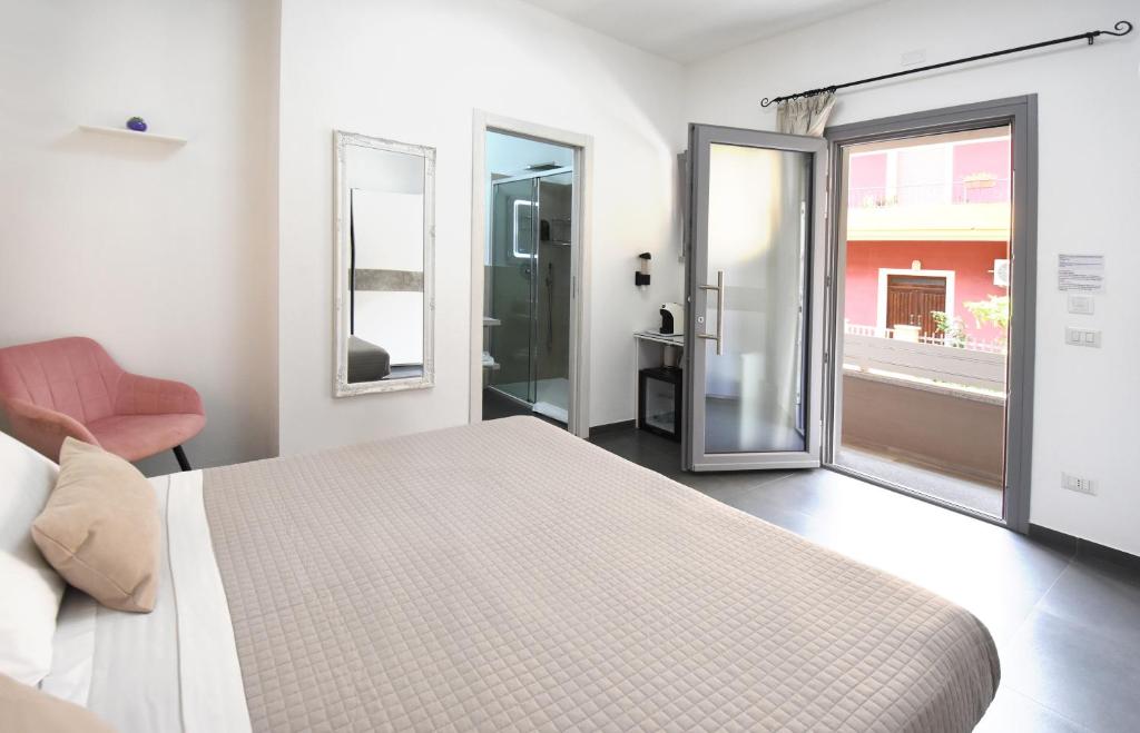 Postel nebo postele na pokoji v ubytování Elis b&b Villasimius