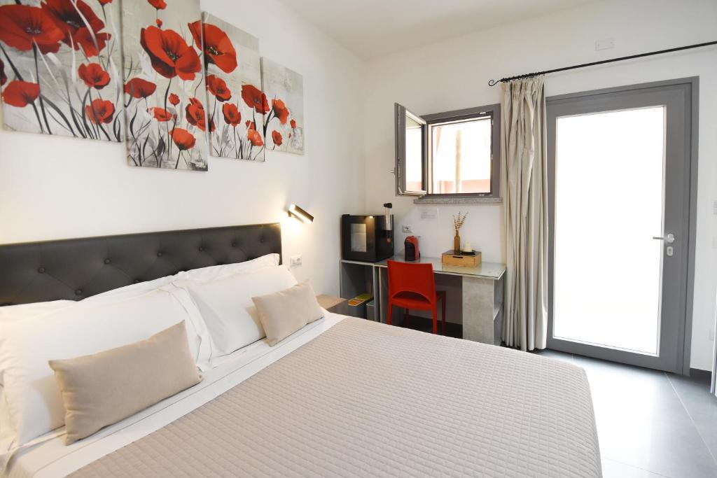 Postel nebo postele na pokoji v ubytování Elis b&b Villasimius
