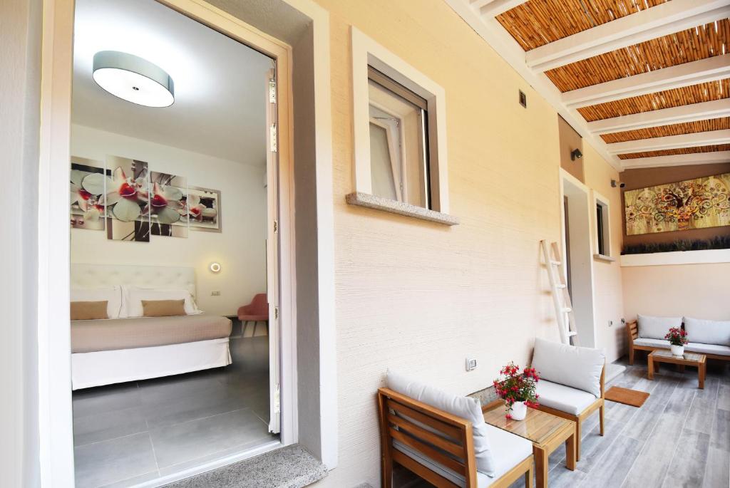 Postel nebo postele na pokoji v ubytování Elis b&b Villasimius