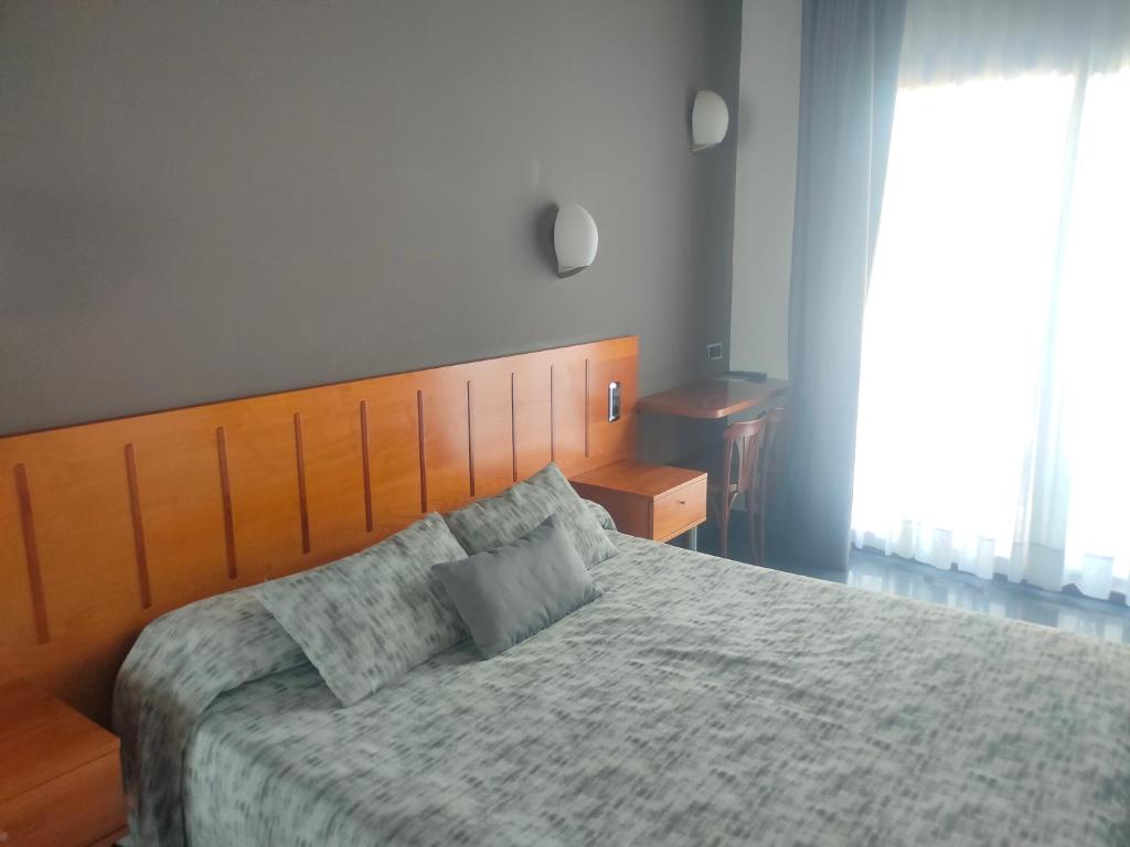 Postel nebo postele na pokoji v ubytování Hotel El Salt
