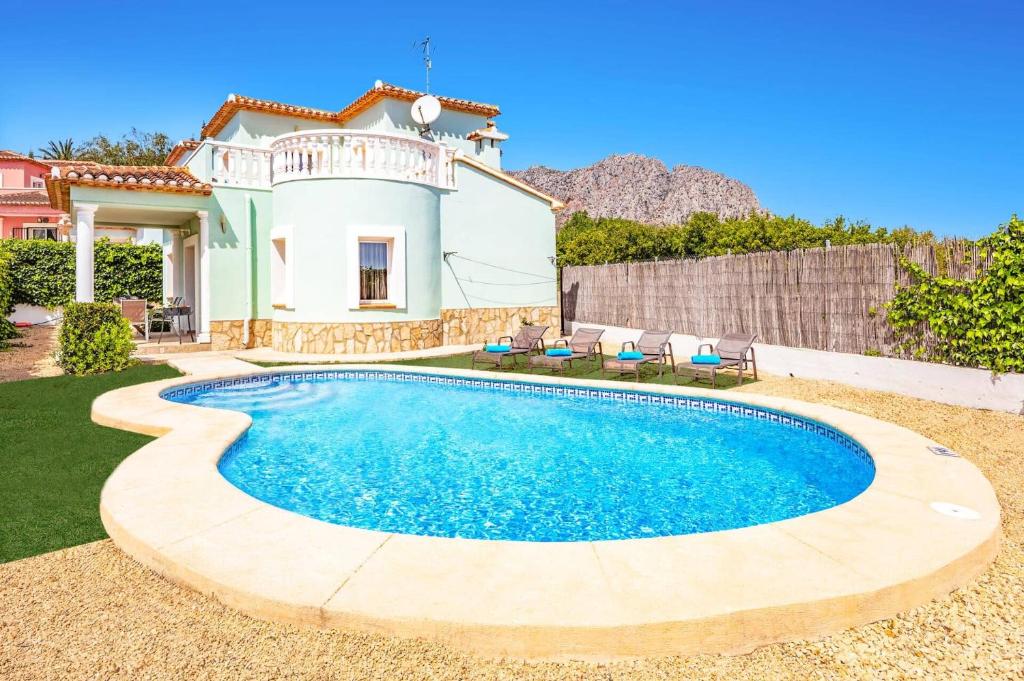 a house with a swimming pool in the yard at Villa Dalia by Villa Plus in Beniarbeig