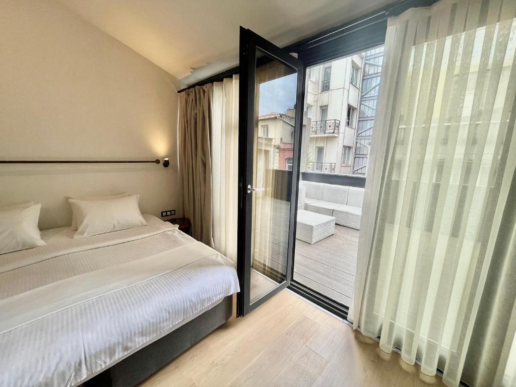 Postel nebo postele na pokoji v ubytování Fitas Oda Hotel