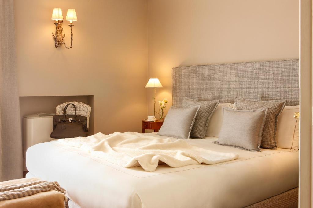 Postel nebo postele na pokoji v ubytování Corte Gondina Boutique Hotel