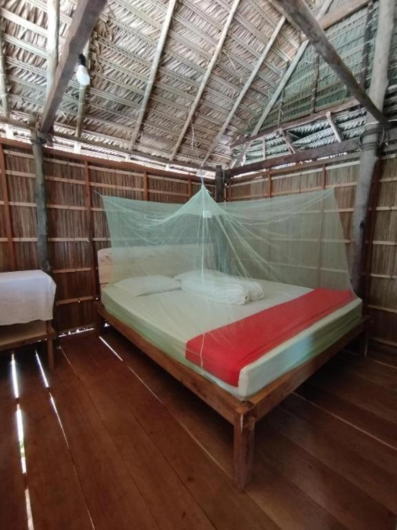 Postel nebo postele na pokoji v ubytování Batanta Panorama Guest' Hause
