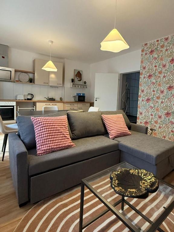 a living room with a couch and a table at Hanse Vermietung 3 in Bremen