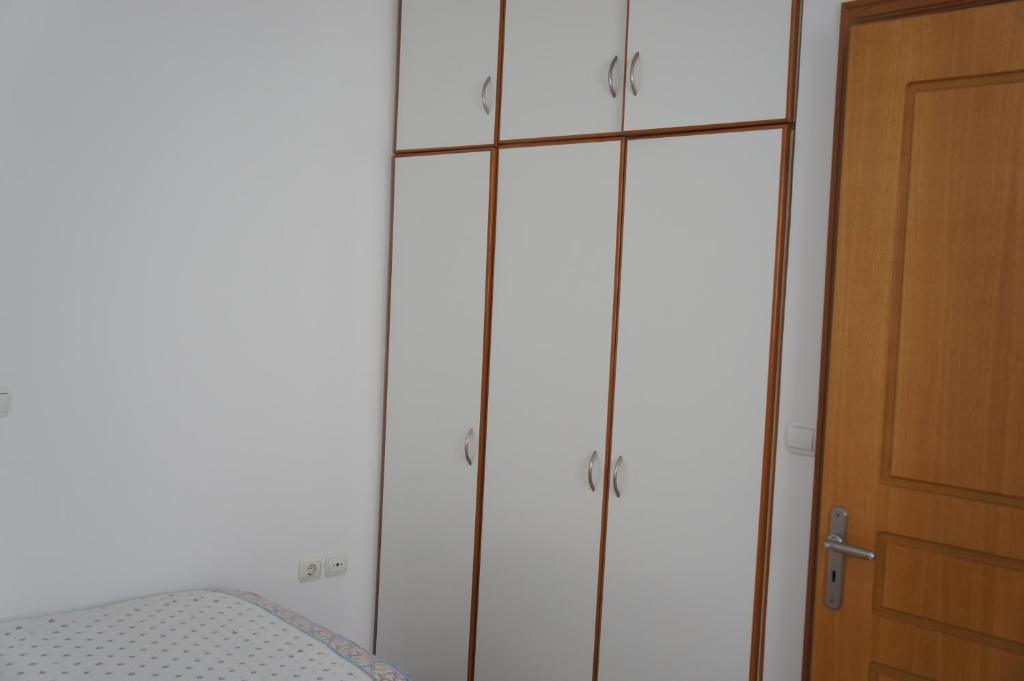 Postel nebo postele na pokoji v ubytování Rodos Beach