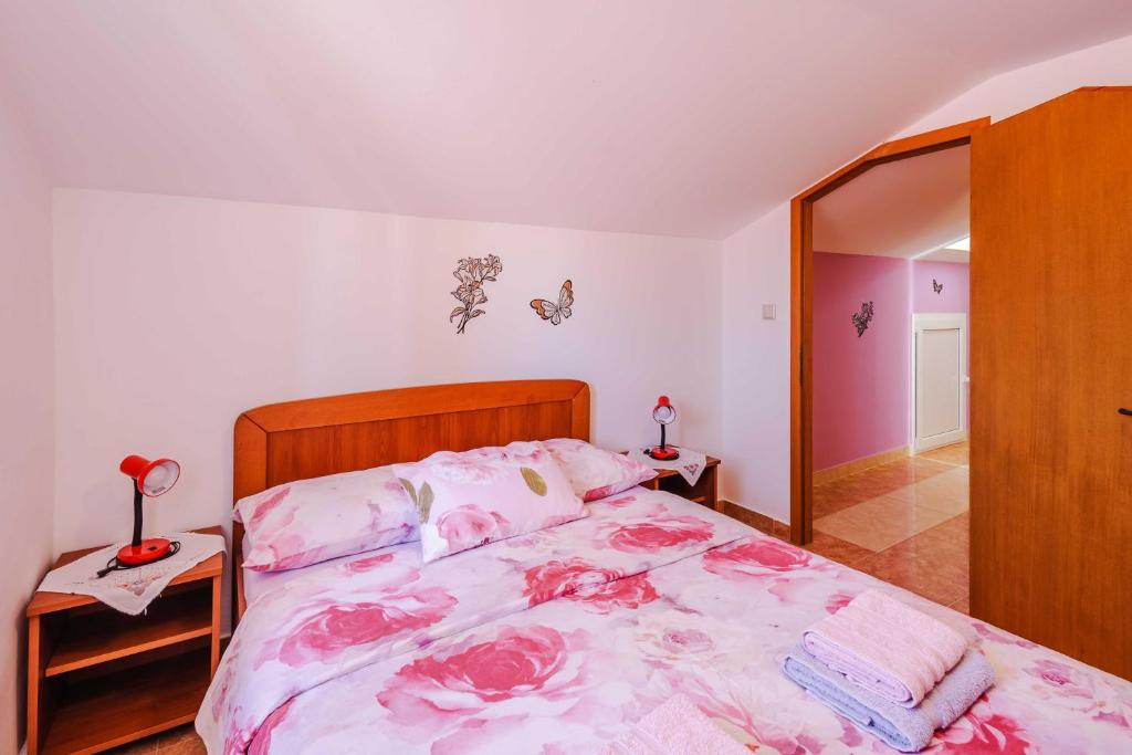Postel nebo postele na pokoji v ubytování Apartments Rose