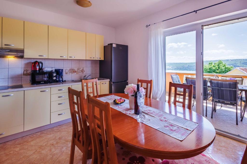 Kuchyň nebo kuchyňský kout v ubytování Apartments Rose