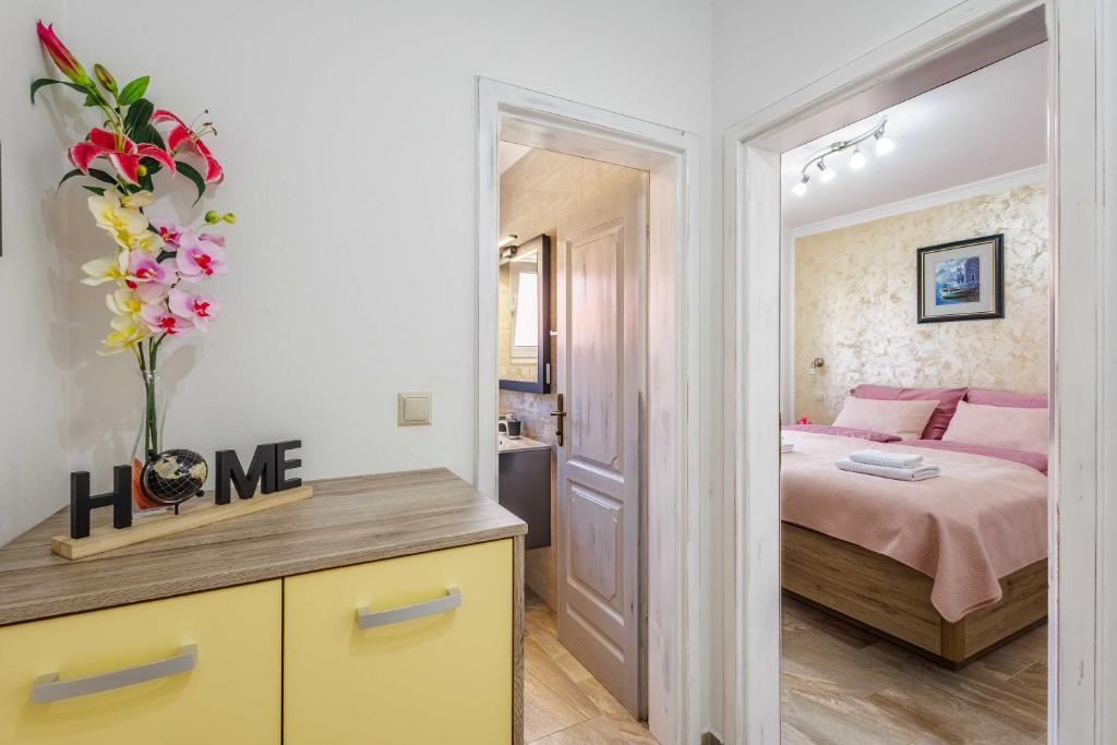 Postel nebo postele na pokoji v ubytování Apartments Rose