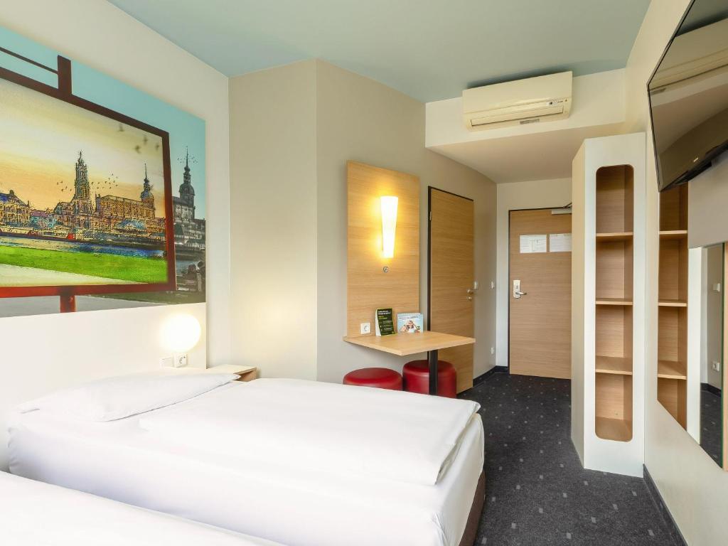 Postel nebo postele na pokoji v ubytování B&B Hotel Dresden-Messe