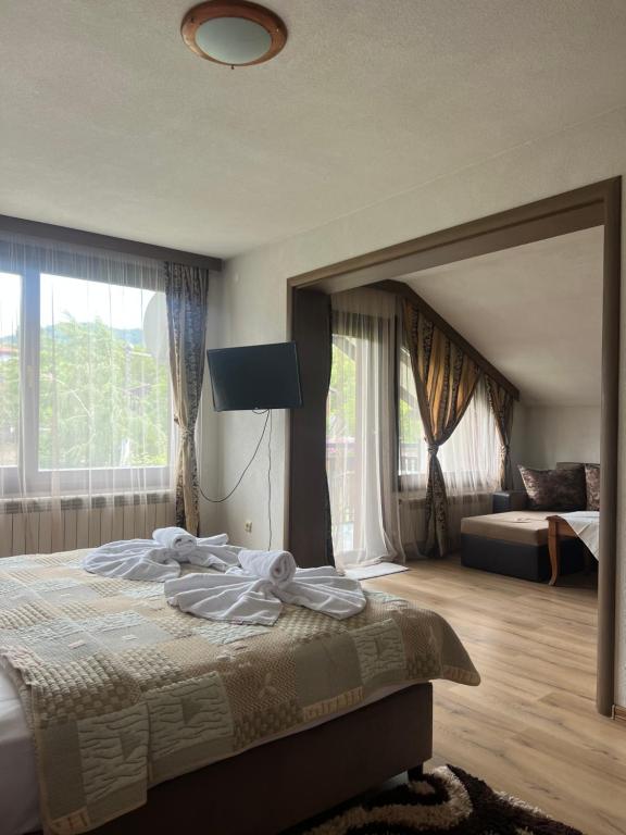 Postel nebo postele na pokoji v ubytování Guest House Raffe