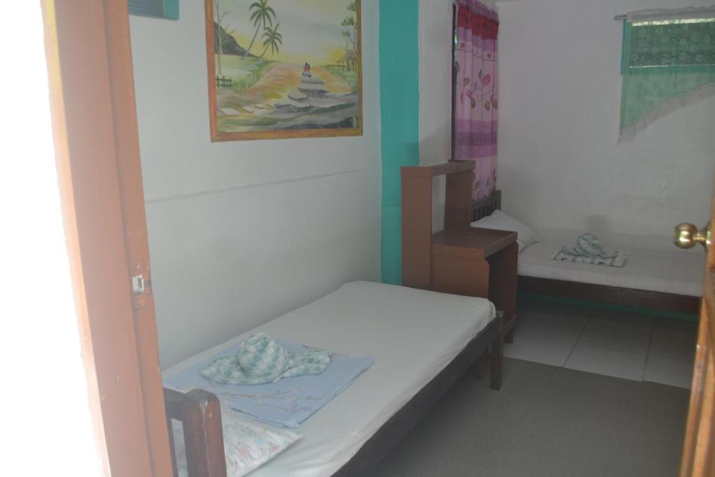 Postel nebo postele na pokoji v ubytování SHENAMAE Pension&Apartel