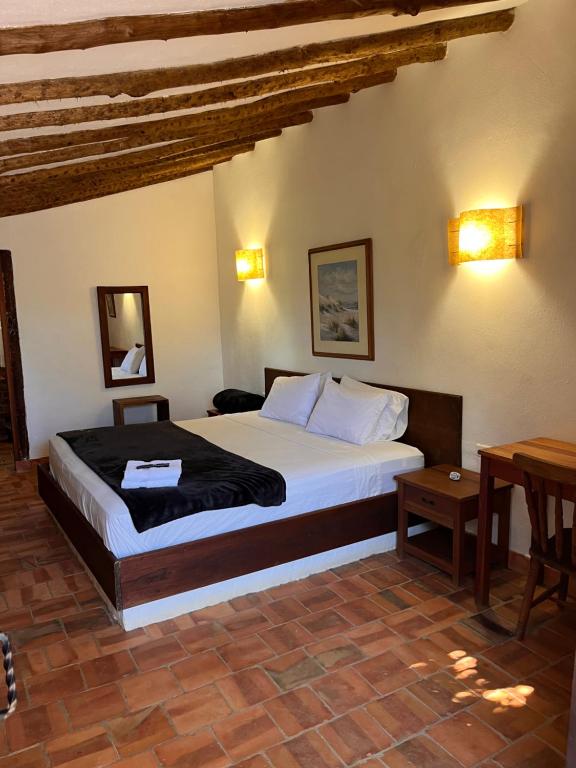 Postel nebo postele na pokoji v ubytování Eco-Lodge Barichara