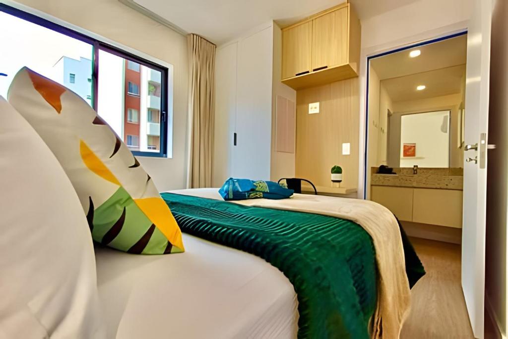 Postel nebo postele na pokoji v ubytování NOViDADE, Apto Moderno e Aconchegante