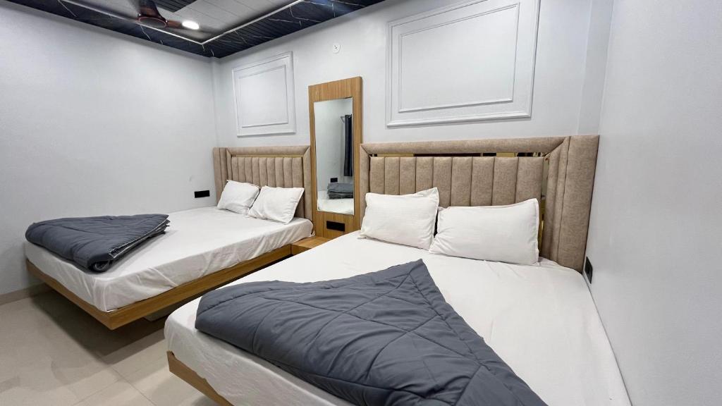 Postel nebo postele na pokoji v ubytování Cloud hotel