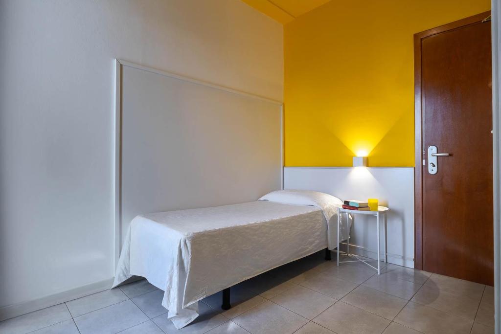 Postel nebo postele na pokoji v ubytování Hotel Portofino