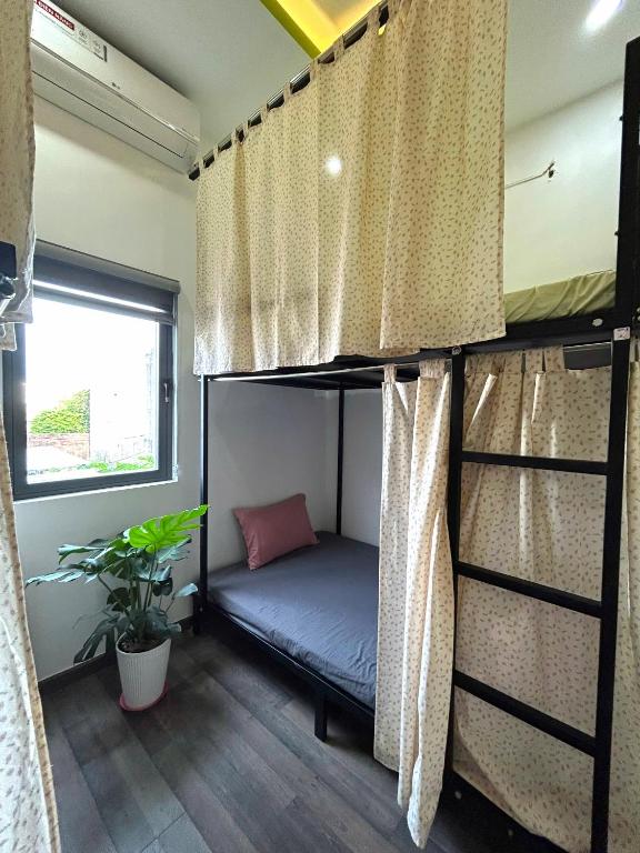 Postel nebo postele na pokoji v ubytování Rami Xanh Stay