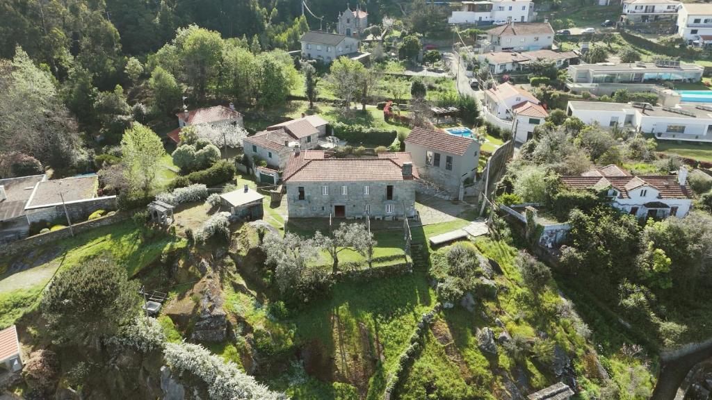 una vista aérea de una casa en una montaña en A Quinta Lanhelas River View, en Caminha