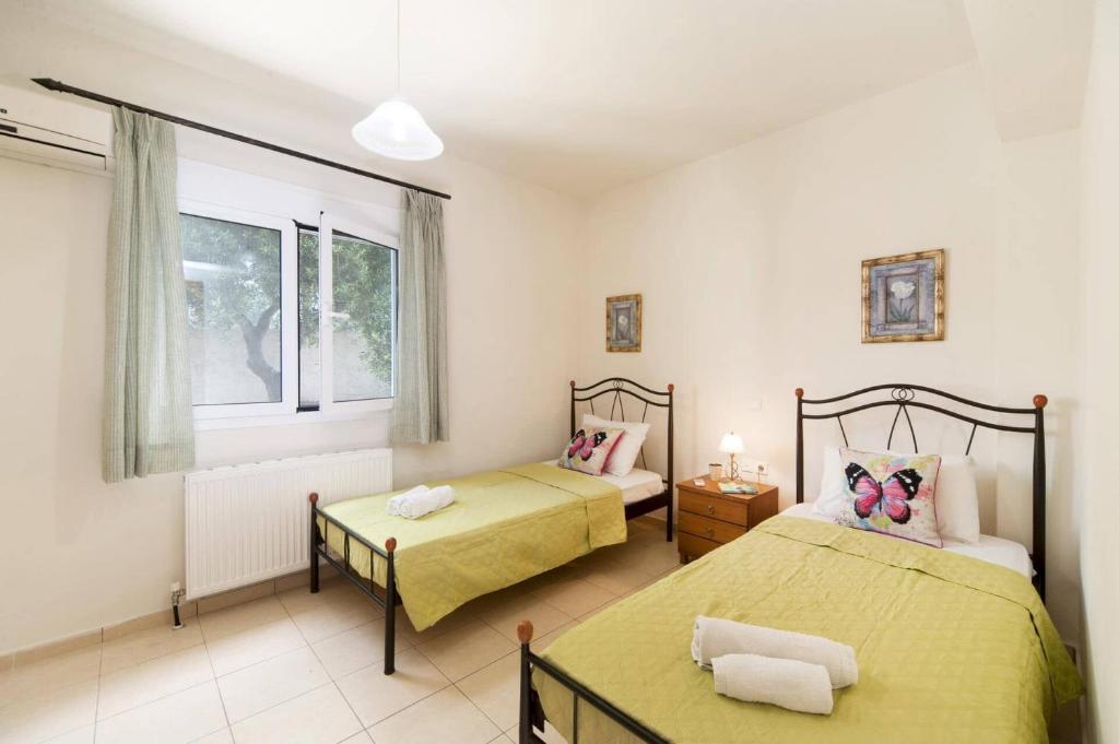 Postel nebo postele na pokoji v ubytování Villa Kastellaki by Villa Plus