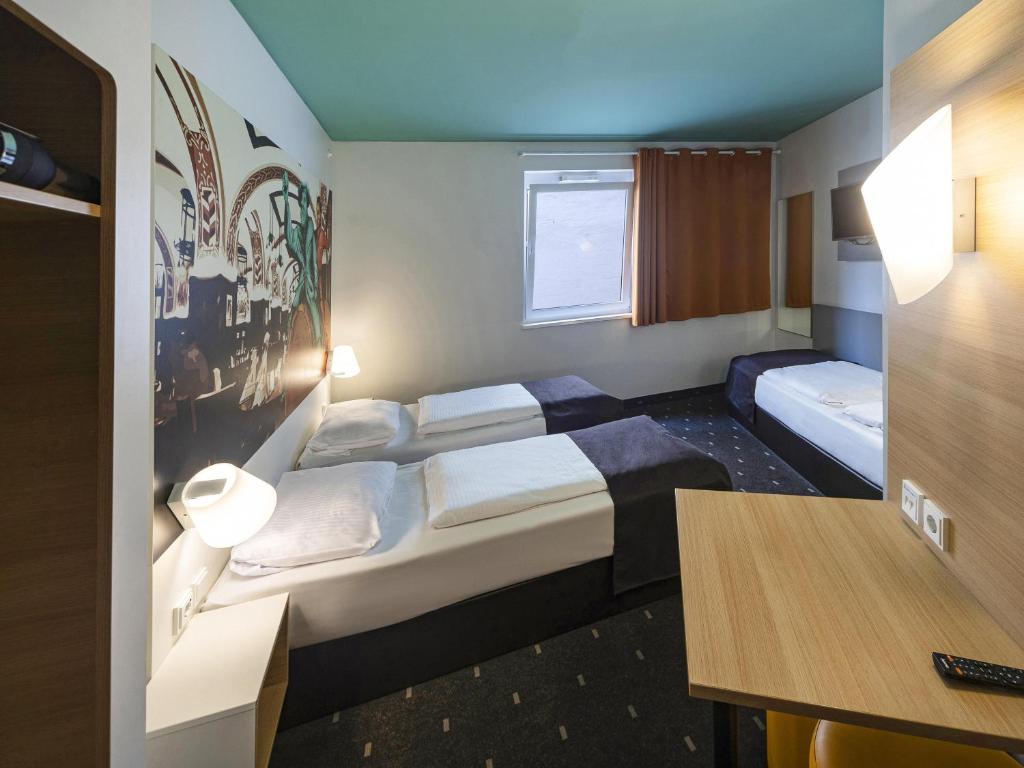 Postel nebo postele na pokoji v ubytování B&B Hotel Leipzig-City