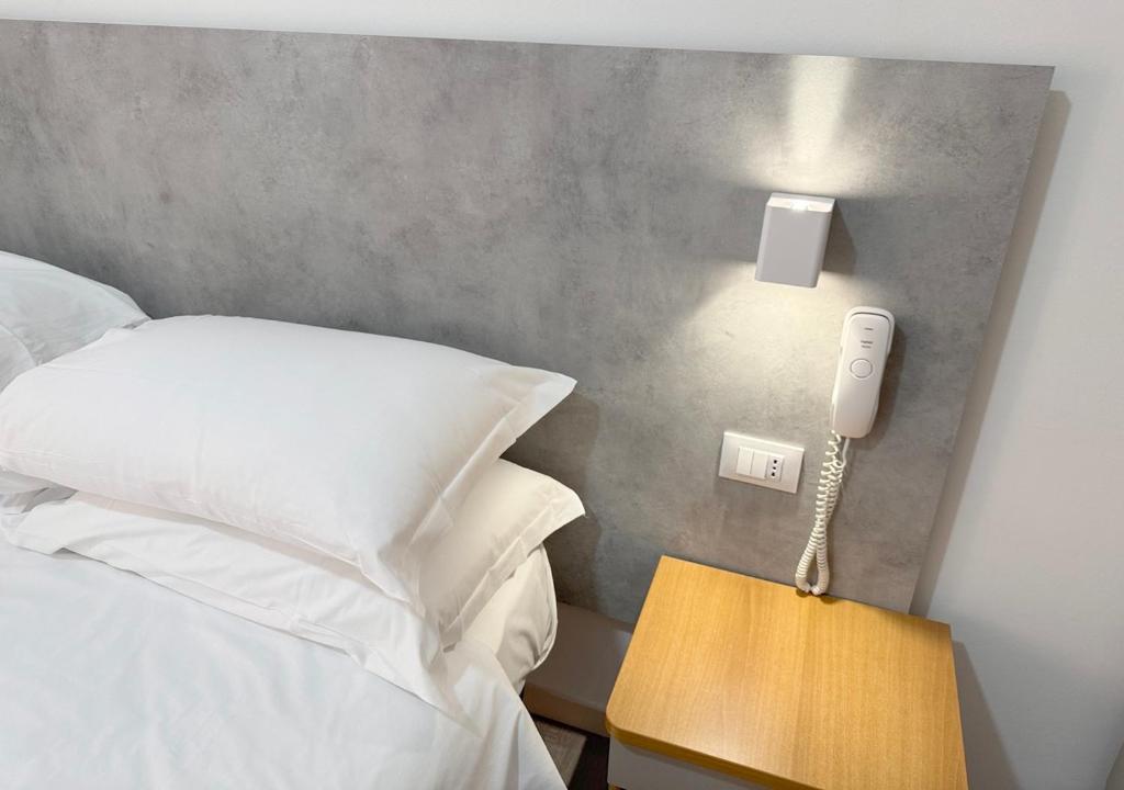 Postel nebo postele na pokoji v ubytování Hotel Ariva