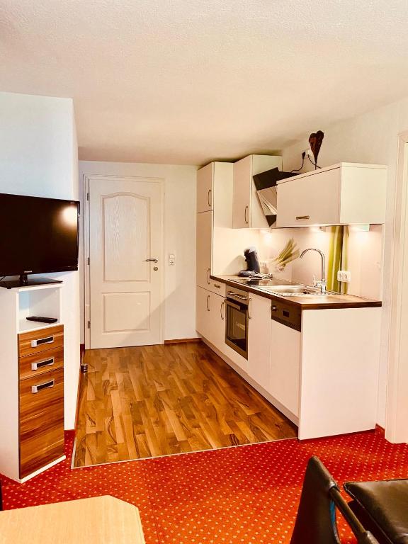Kuchyň nebo kuchyňský kout v ubytování Gästehaus Hoamat'l