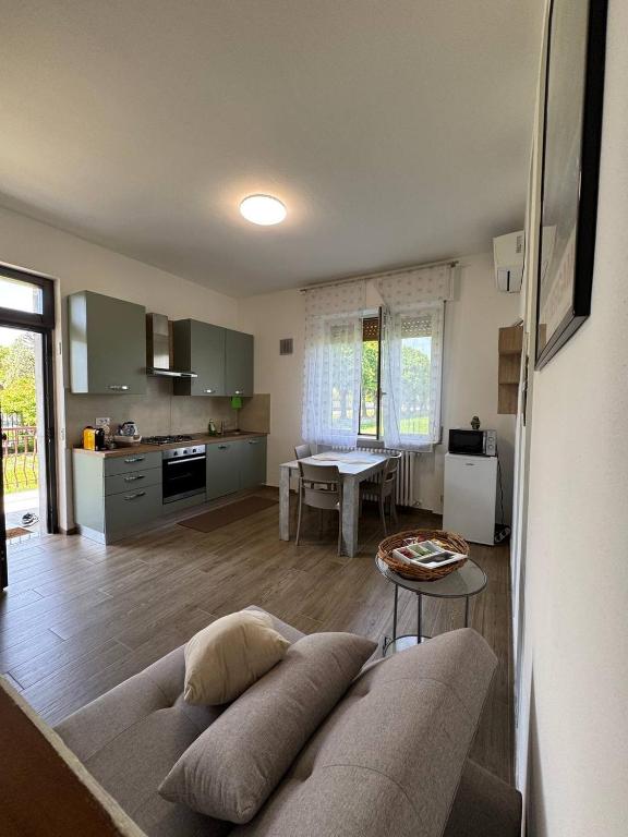a living room with a couch and a table at Casa di Sara - Comfort, Privacy, Posizione in Zanica