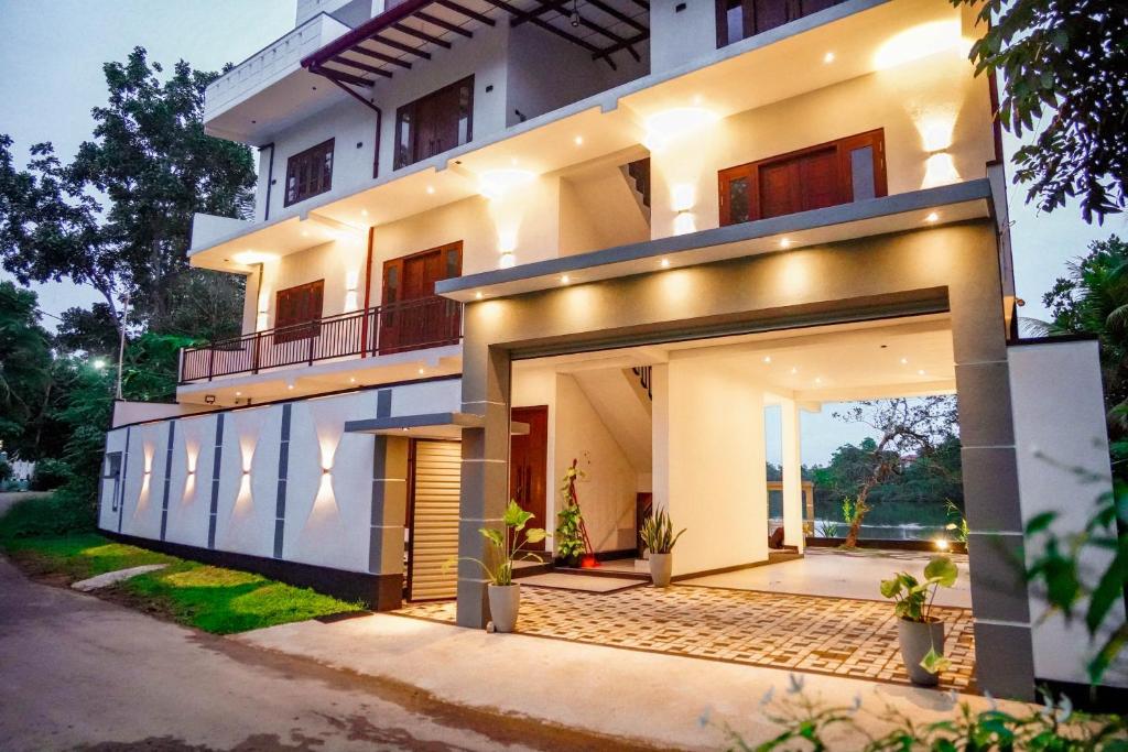 an exterior view of a house at night at Elegance Lake View in Habaraduwa Central