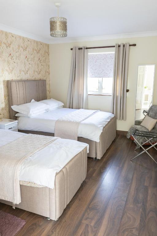 Postel nebo postele na pokoji v ubytování Brielle House