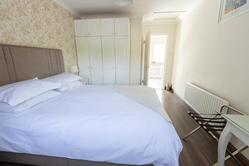 Postel nebo postele na pokoji v ubytování Brielle House