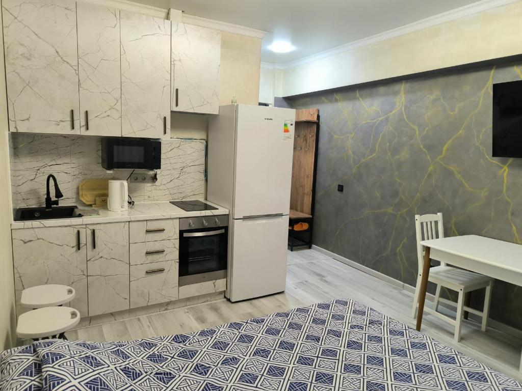 Kuchyň nebo kuchyňský kout v ubytování Апартаменты Компания Феникс