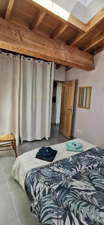 Postel nebo postele na pokoji v ubytování Gîte de Riosset