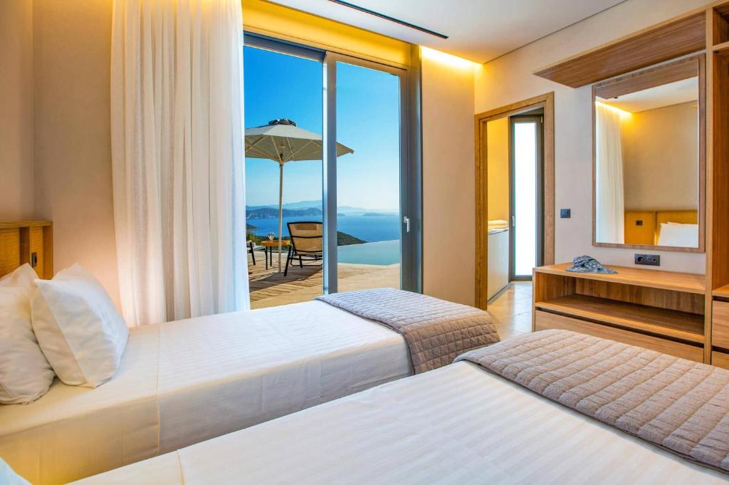 Posteľ alebo postele v izbe v ubytovaní Villa Yasemi by Villa Plus