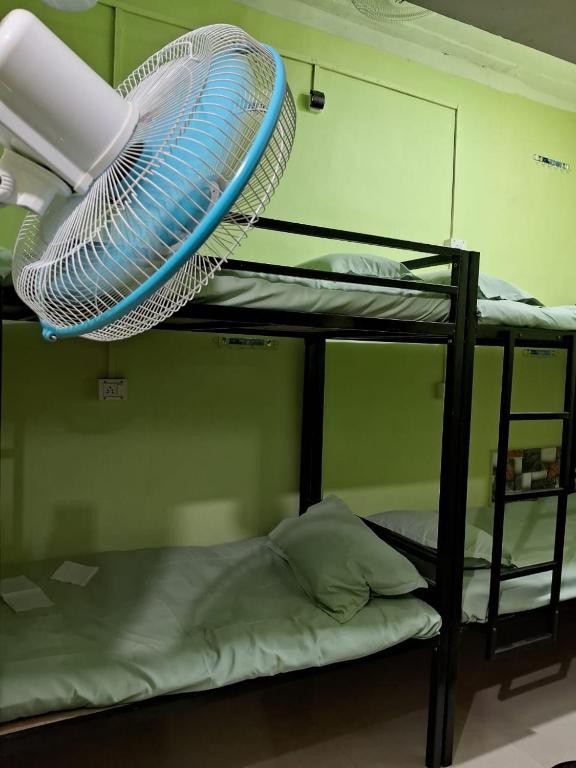 Postel nebo postele na pokoji v ubytování Homestay Dormitory