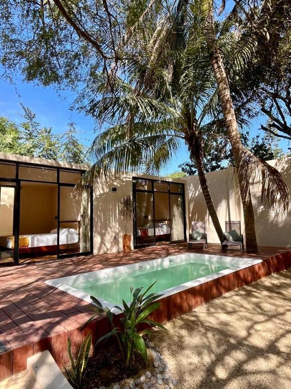 a house with a swimming pool in the yard at Casa Yag in Brisas de Zicatela