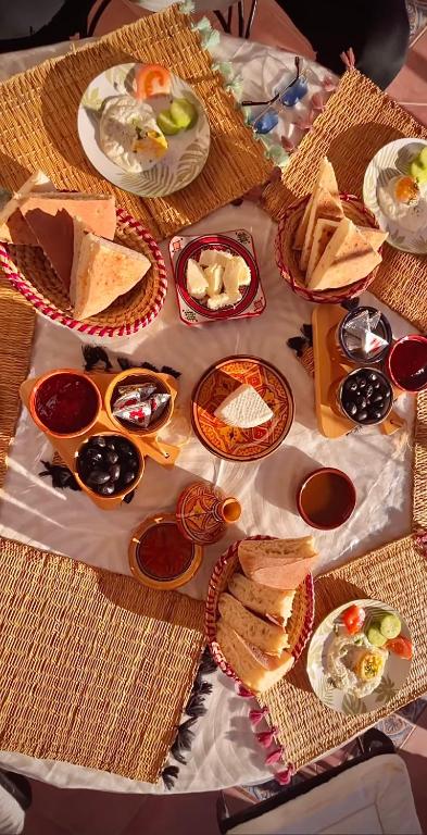 a table with many plates of food on it at Dar Bakkali Nadi in Tangier