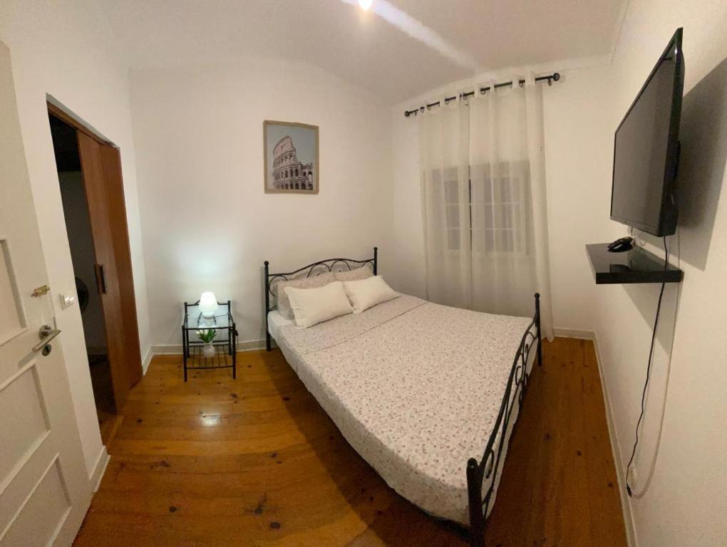 Postel nebo postele na pokoji v ubytování Travelers House