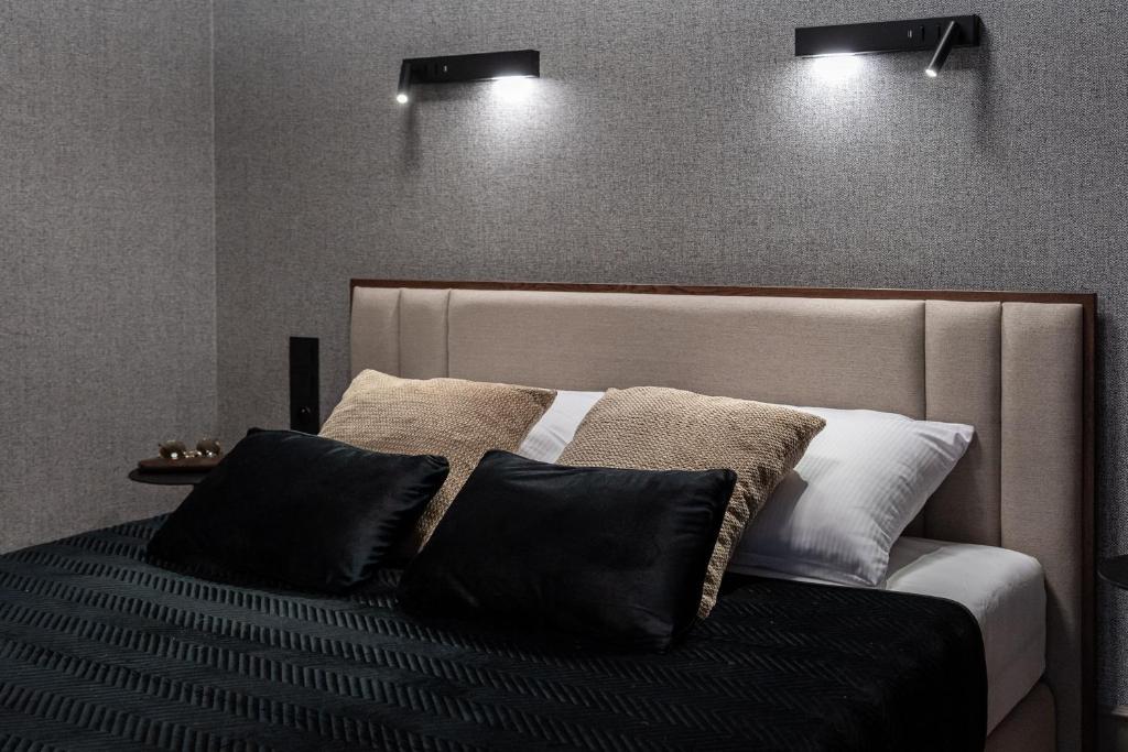 Postel nebo postele na pokoji v ubytování Lavoo Boutique Apartments