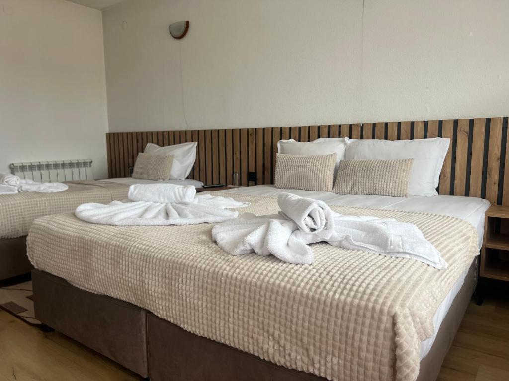 Postel nebo postele na pokoji v ubytování Guest House Raffe