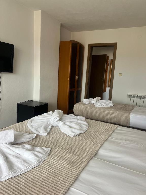Postel nebo postele na pokoji v ubytování Guest House Raffe