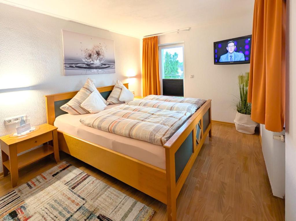 Postel nebo postele na pokoji v ubytování Hotel Maurer
