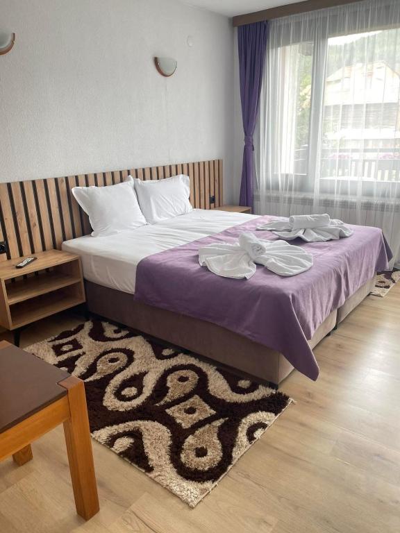 Postel nebo postele na pokoji v ubytování Guest House Raffe