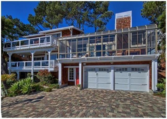 a large house with two garage doors and a balcony at Casa Coventry in Cambria