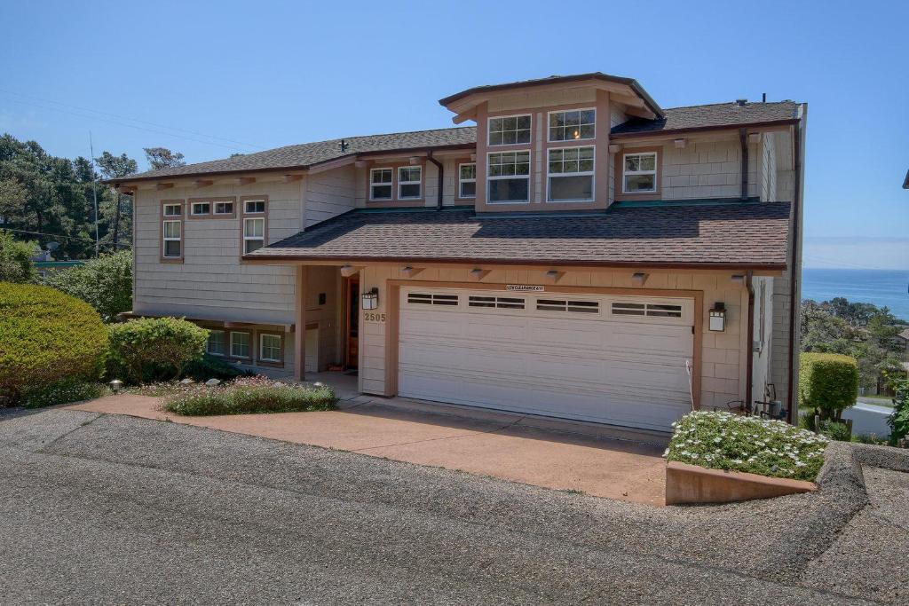 a house with a two garage doors in front at Dream Catcher in Cambria