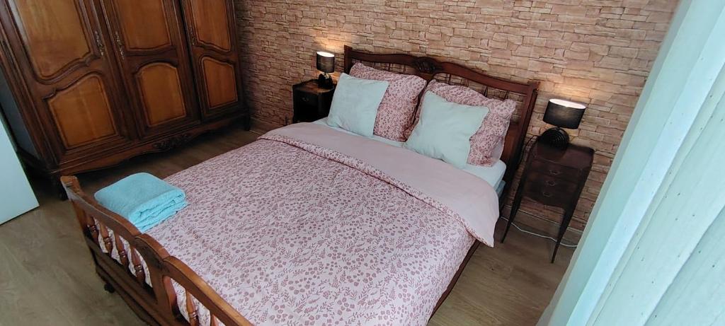 Postel nebo postele na pokoji v ubytování Le Petit Recoin