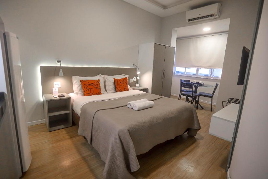 Cama ou camas em um quarto em Injoy Lofts & Studios Ipanema