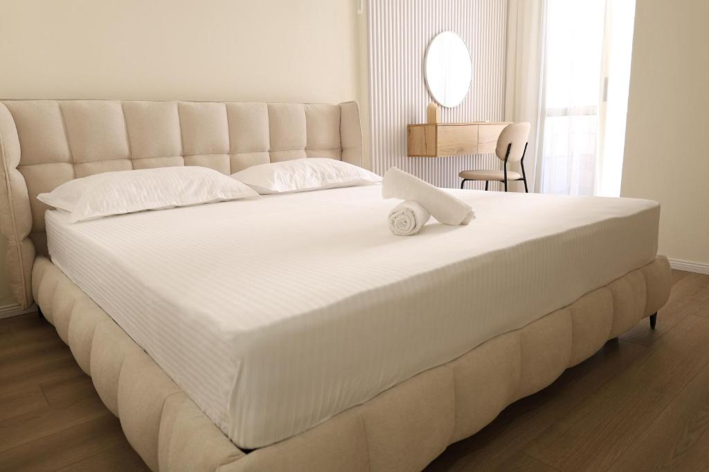 Postel nebo postele na pokoji v ubytování Tiara Apartments
