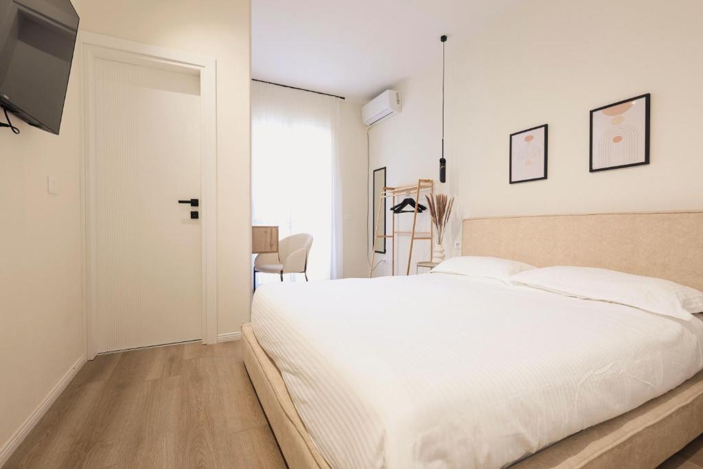 Postel nebo postele na pokoji v ubytování Tiara Apartments