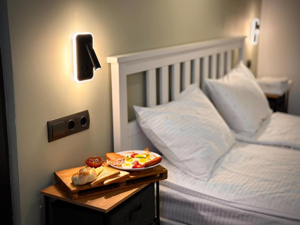 Postel nebo postele na pokoji v ubytování Tiroents Hotel